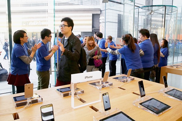 Apple store employees welcome the customers to buy iPhone 6 and iPhone 6 Plus at an Apple store on Oct. 17, 2014 in Beijing, China. 