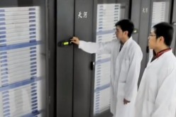 China's computer scientists inspect the Tianhe-2 supercomputer, which has been beaten by the new Sunway TaihuLight