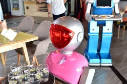 Robot waiters serve at a restaurant in Yiwu, China.