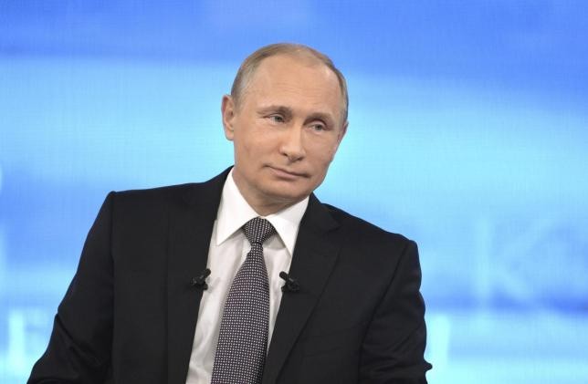 Russian President Vladimir Putin appears on Russian television during a live broadcast in Moscow.