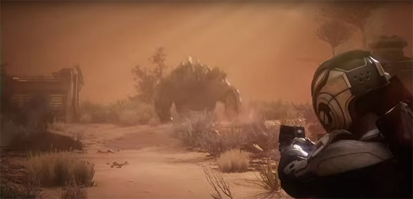 "Mass Effect: Andromeda" protagonist shoots a giant alien enemy who is trying to kill him/her.
