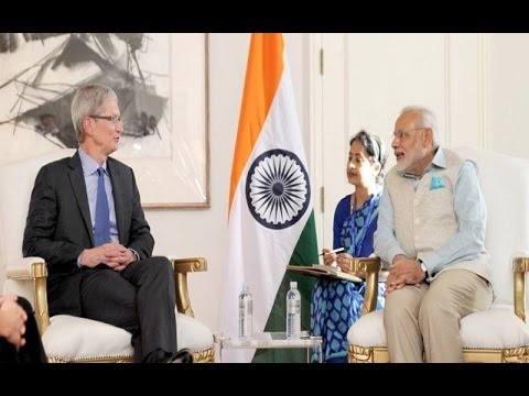Apple CEO Tim Cook speaks with Prime Minister Narendra Modi during his visit to India earlier this year.