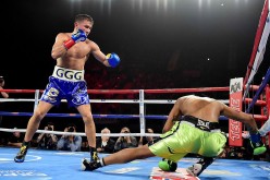 Gennady Golovkin of Kazakhstan knocks down Dominc Wade for the second time on way to a second round TKO during his unified middleweight title fight at The Forum on April 23, 2016 in Inglewood, California.