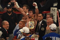 Manny Pacquiao celebrates after defeating Timothy Bradley Jr. in their welterweight fight on April 9, 2016 at MGM Grand Garden Arena in Las Vegas, Nevada.
