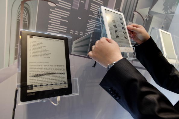 A visitor examines the DR-900 9' Touch E-Reader at the Asus stand at the CeBIT Technology Fair on March 2, 2010 in Hannover, Germany.