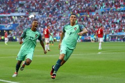 Portugal forwards Cristiano Ronaldo (R) and Nani.
