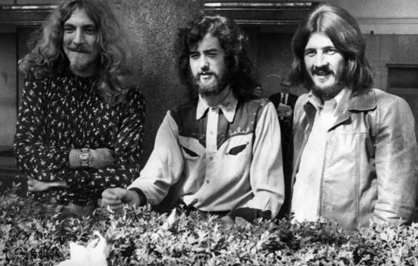 Three of the four members of British heavy rock group Led Zeppelin, singer Robert Plant, guitarist Jimmy Page and drummer John Bonham pose for a photo in Embankment Gardens, London on Sept. 16, 1970. 