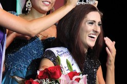 Miss Missouri 2016 Erin O'Flaherty is being crowned by Miss Missouri 2016 McKensie Garber and the new 2016 Miss Missouri's Outstanding Teen Christina Stratton, her arm seen, in Mexico, Mo.