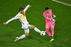 Spain striker Alvaro Morata shoots the ball against Croatia goalkeeper Danijel Subasic.