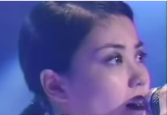 Faye Wong sings in one of her past live performances.   