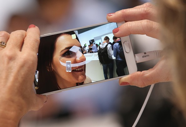 A visitor tries out the camera on a Galaxy Note 5 smartphone at the Samsung stand during a press day at the 2015 IFA consumer electronics and appliances trade fair on Sept. 3, 2015 in Berlin, Germany. 