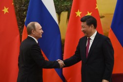 Chinese President Xi Jinping and Russian President Vladimir Putin make a joint statement during the latter's state visit in Beijing.