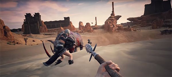 "Conan Exiles" characters fight off a large animal in an arid desert to survive.