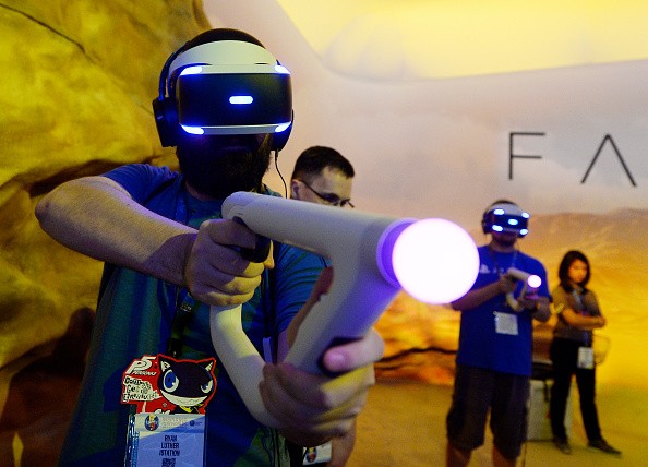 Gamers try out the new Sony VR headset in Sony Playstation booth during the annual E3 2016 gaming conference at the Los Angeles Convention Center on June 14, 2016 in Los Angeles, California. 