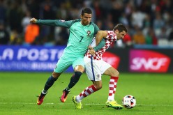 Portugal forward Cristiano Ronaldo (L) competes for the ball against Croatia's Darijo Srna.