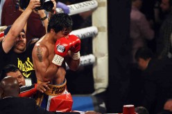 Manny Pacquiao celebrates at the end of the 12th round of his welterweight fight against Timothy Bradley Jr. on April 9, 2016 at MGM Grand Garden Arena in Las Vegas, Nevada.