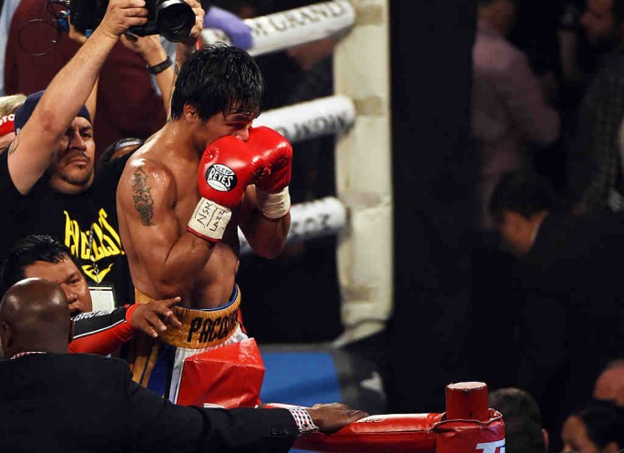 Manny Pacquiao celebrates at the end of the 12th round of his welterweight fight against Timothy Bradley Jr. on April 9, 2016 at MGM Grand Garden Arena in Las Vegas, Nevada.