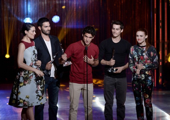 The Cast of Teen Wolf, Crystal Reed, Tyler Hoechlin, Tyler Posey, Dylan O'Brien, and Holland Roden receive the Best Ensemble Award on stage at the CW Network's 2013 Young Hollywood Awards on August 1, 2013 in Santa Monica, California. 