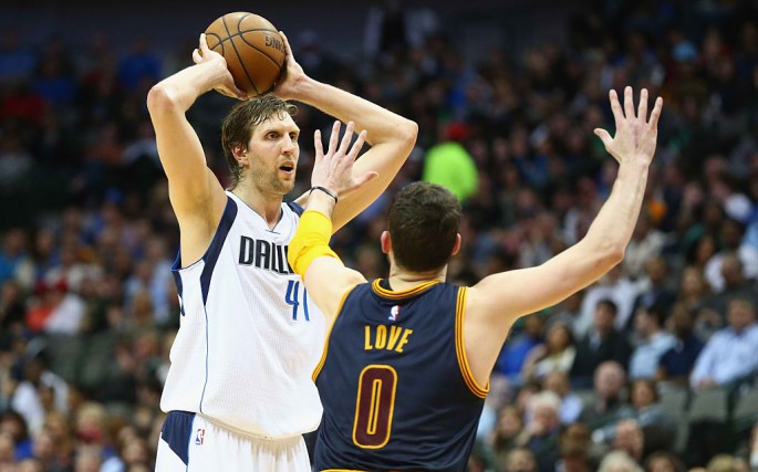 Dirk Nowitzki #41 of the Dallas Mavericks looks to pass against Kevin Love #0 of the Cleveland Cavaliers at American Airlines Center on March 10, 2015 in Dallas, Texas