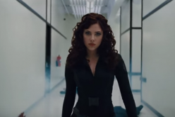 Black Widow (Scarlett Johansson) fights and subdues several men in an 