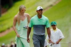 Tiger Woods of the United States walks with his girlfriend Lindsey Vonn and daughter Sam during the Par 3 Contest prior to the start of the 2015 Masters Tournament at Augusta National Golf Club on April 8, 2015 in Augusta, Georgia.