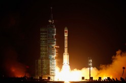 Thousands of tourists and space enthusiasts gather to witness the launch of Long March 7 at the Wenchang Satellite Launch Center.