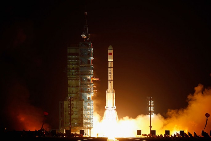 Thousands of tourists and space enthusiasts gather to witness the launch of Long March 7 at the Wenchang Satellite Launch Center.
