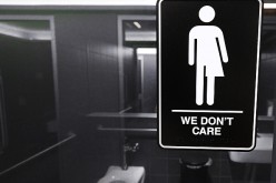 Gender neutral signs are posted in the 21C Museum Hotel public restrooms on May 10, 2016 in Durham, North Carolina. 