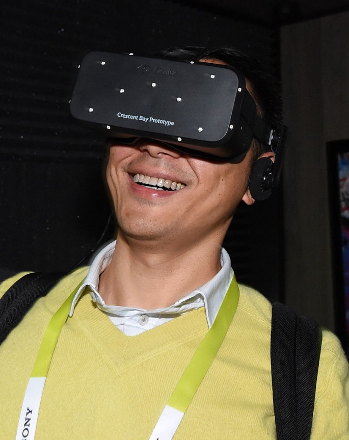 A man tests a virtual reality goggle at the 2015 International CES.