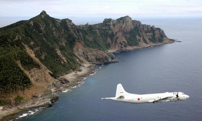 A Japanese surveillance plane flies over the disputed islands in East China Sea.