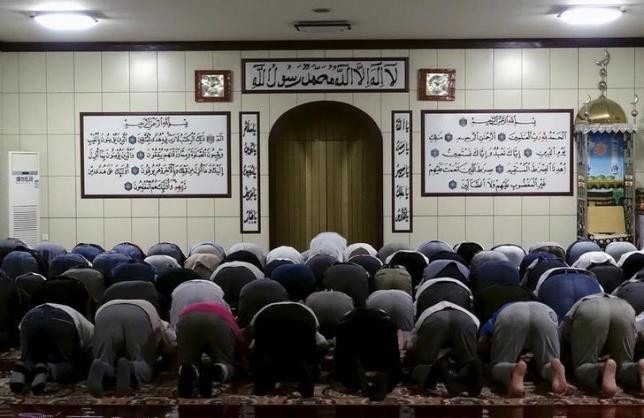 Muslims pray at a mosque in Xinjiang Uyghur Autonomous Region during Ramadan.