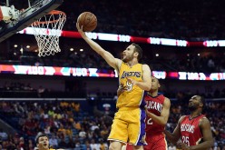 Los Angeles Lakers point guard Marcelo Huertas drives for a layup against the New Orleans Pelicans.