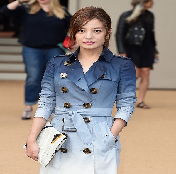 Vicki Zhao attends the Burberry Womenswear SS15 show during London Fashion Week at Kensington Gardens on September 15, 2014 in London, England.