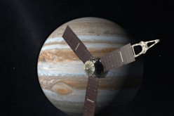 The Juno space probe is seen approaching Jupiter.