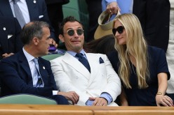 Mark Cairney, Jude Law and Phillipa Coan watch on as Switzerland's Roger Federer plays Canada's Milos Raonic at the Wimbledon Championships 2016 in London, England. 