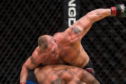 Brock Lesnar gets on Mark Hunt's top and repeatedly pounds him.