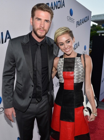 Actor Liam Hemsworth and singer Miley Cyrus attend the premiere of Relativity Media's 'Paranoia' at DGA Theater on August 8, 2013 in Los Angeles, California.