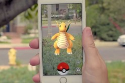A Pokémon Go player encounters a Dragonite on his lawn.