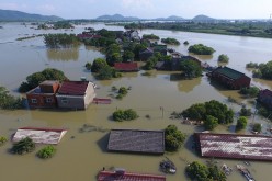 Aerial view of houses being flooded in Dongyun Village of Liqiao Town on July 7, 2016 in Xuancheng, Anhui Province of China. 