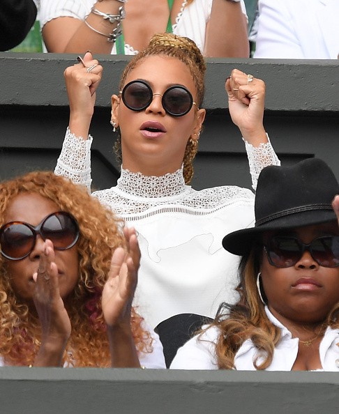 Beyonce pumps her fists for Serena Williams during the Wimbledon Championships.