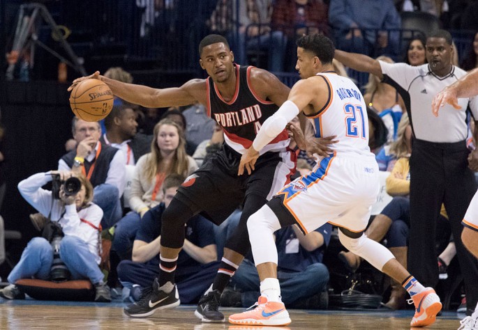 Portland Trail Blazers forward Maurice Harkless (L) posts up against Oklahoma City Thunder's Andre Roberson.
