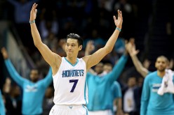  Jeremy Lin #7 of the Charlotte Hornets reacts after making a basket against the San Antonio Spurs during their game at Time Warner Cable Arena on March 21, 2016 in Charlotte, North Carolina.
