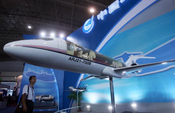 A visitor views a model of the ARJ21 regional jet at the China International Exhibition Center on September 19, 2007 in Beijing, China. 