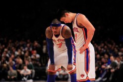 Carmelo Anthony and Jeremy Lin stand on the court against the New Jersey Nets at Madison Square Garden on February 20, 2012.