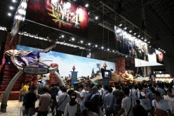  Attendees visit the Capcom Co. booth to play the company's 'Monster Hunter 4' during the Tokyo Game Show 2012 at Makuhari Messe.