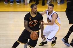 Cleveland Cavaliers shooting guard JR Smith (L) drives past Golden State Warriors' Stephen Curry.