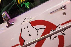 The Ghostbusters logo is displayed on the door of the Ecto-1 Cadillac station wagon