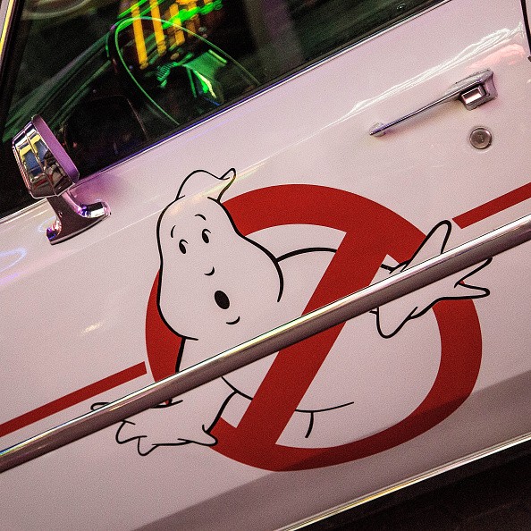 The Ghostbusters logo is displayed on the door of the Ecto-1 Cadillac station wagon
