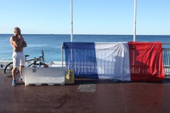 The French flag is prominently displayed along the Promenade des Anglais, the scene of a terrorist attack that killed at least 84.