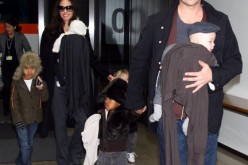 ctor Brad Pitt and Angelina Jolie arrive at Narita International Airport with their children (L to R) Maddox, Vivienne, Zahara and Knox on January 27, 2009 in Narita, Chiba, Japan. Brad is visiting Japan to promote his film 'The Curious Case Of Benjamin B